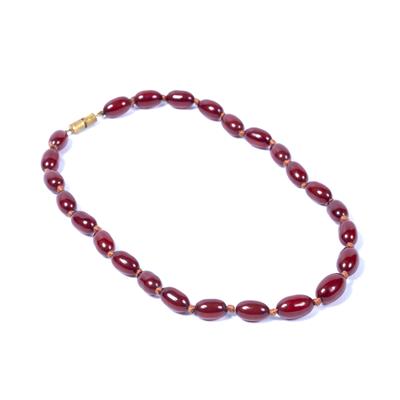 Lot 446 - Ruby coloured amber necklace