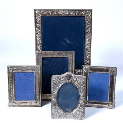 Lot 477 - Collection of five silver and white metal photo frames