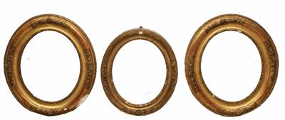 Lot 485 - A PAIR OF 19TH CENTURY OVAL GILT AND GESSO FRAMES moulded with floral sprays