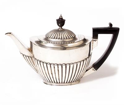 Lot 407 - AN OVAL SILVER TEAPOT