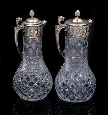 Lot 416 - TWO CUT GLASS SILVER PLATED LIDDED CLARET JUGS