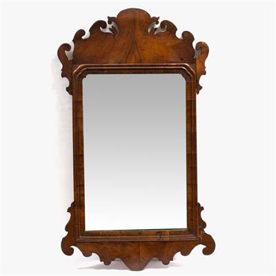 Lot 548 - A GEORGE III WALNUT FRET FRAMED WALL MIRROR