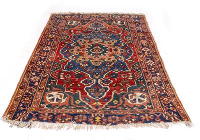 Lot 597 - AN OLD BLUE GROUND ORIENTAL RUG