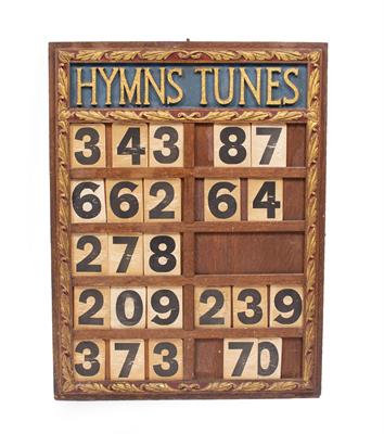 Lot 673 - AN OAK HYMN BOARD