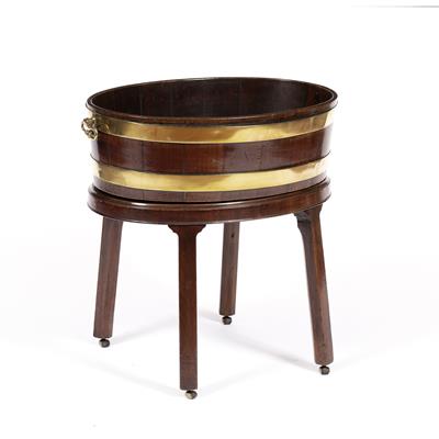 Lot 18 - A GEORGE III MAHOGANY AND BRASS BOUND OVAL WINE COOLER with twin handles