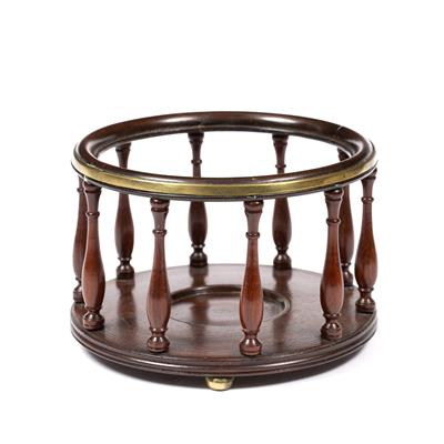 Lot 32 - A MAHOGANY AND BRASS WINE COASTER of circular form