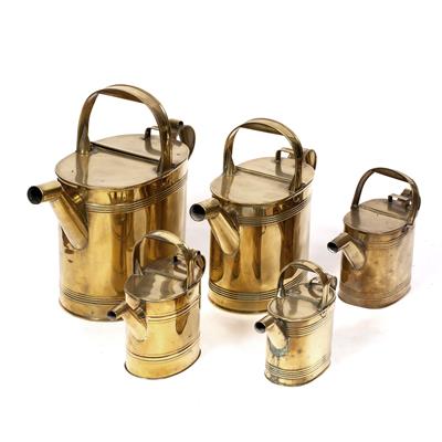 Lot 38 - A COLLECTION OF FIVE 19TH CENTURY GRADUATED BRASS WATERING CANS with fixed loop handles