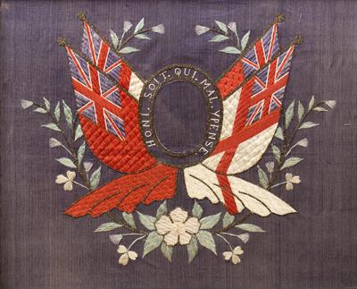 Lot 51 - A LATE 19TH CENTURY SILKWORK REGIMENTAL PANEL with central oval reserve bordered by 'Honi soit qui