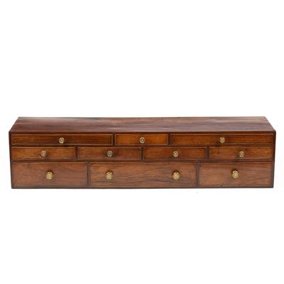 Lot 61 - A 19TH CENTURY MAHOGANY STATIONERY CHEST with an arrangement of ten small cockbeaded drawers