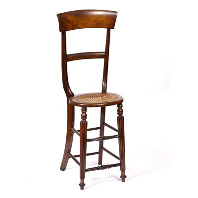 Lot 99 - AN EARLY 19TH CENTURY MAHOGANY CORRECTION CHAIR with tall bar back and caned seat