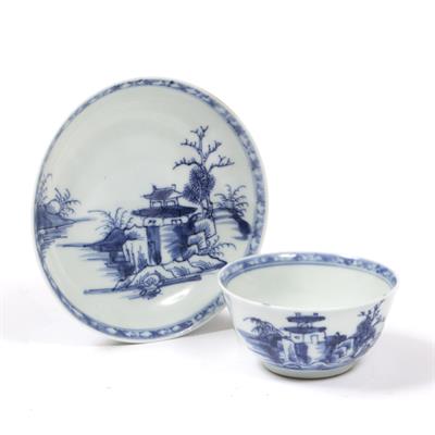 Lot 129 - A CHINESE NANKING CARGO BLUE AND WHITE TEA BOWL AND SAUCER