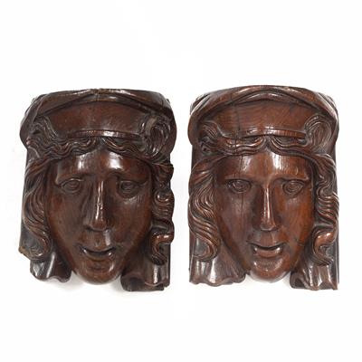 Lot 136 - A PAIR OF 17TH/18TH CENTURY CARVED OAK HEADS