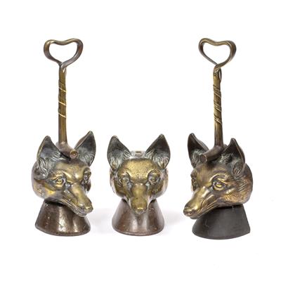 Lot 152 - A PAIR OF 19TH CENTURY BRASS AND IRON FOX MASK DOORSTOPS