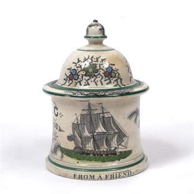 Lot 153 - A MID 19TH CENTURY POTTERY CYLINDRICAL TOBACCO JAR AND DOMED COVER