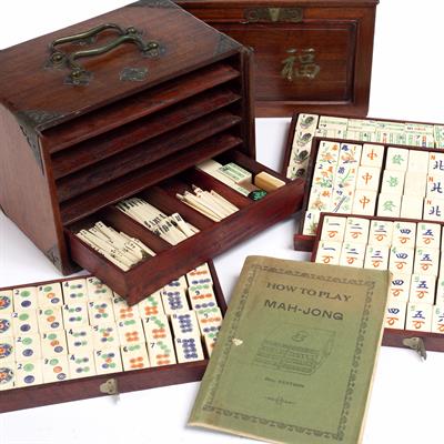 Lot 222 - A CHINESE BONE AND BAMBOO MAH JONG SET in hardwood box with silding front and five drawers