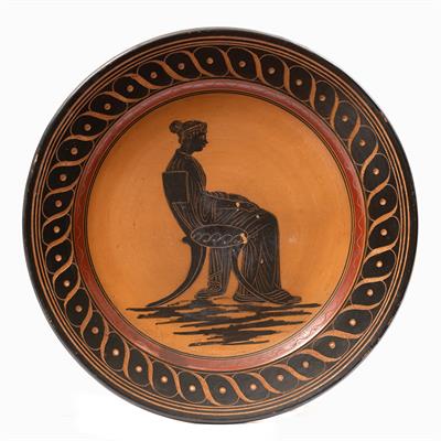 Lot 228 - A GRAND TOUR TERRACOTTA PLATE decorated in black with a seated classical figure