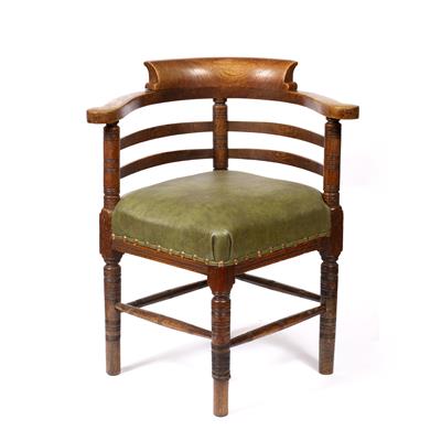 Lot 247 - AN EDWARDIAN OAK CORNER OFFICE CHAIR with curved back and arms and having studded green upholstered