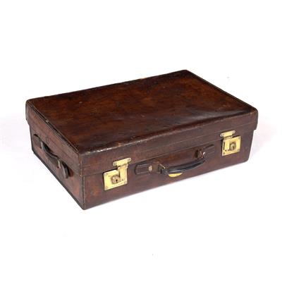 Lot 256 - A 19TH CENTURY LEATHER SUITCASE the brass locks stamped B. Finnigan