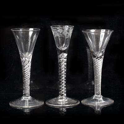 Lot 313 - TWO 18TH CENTURY WINE GLASSES with flared conical bowls and air twist stems