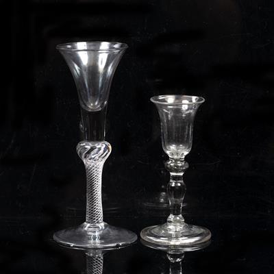 Lot 322 - AN 18TH CENTURY WINE GLASS with flared conical bowl to a inverted baluster and multiple air twist