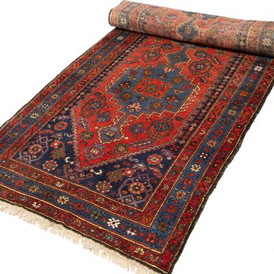 Lot 337 - A HAMADAN BRICK RED GROUND LONG RUNNER