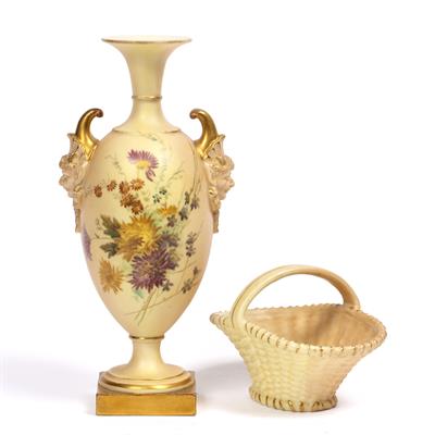 Lot 363 - A ROYAL WORCESTER PORCELAIN BALUSTER VASE with mask handles and floral decoration