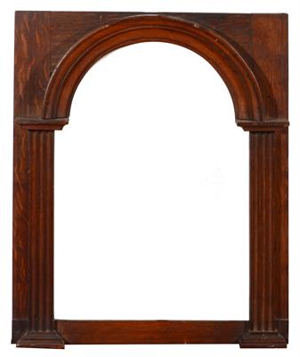 Lot 468 - A LATE VICTORIAN OAK FRAME of arched form with fluted pilasters