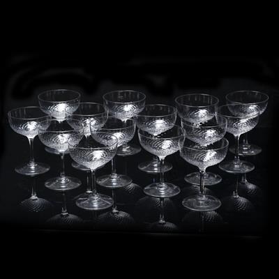 Lot 247 - Set of fourteen champagne glasses