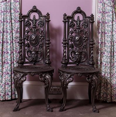 Lot 10 - TWO POSSIBLY FRENCH CAST IRON HIGH BACKED CHAIRS