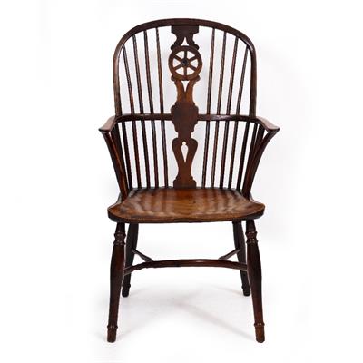 Lot 22 - AN ANTIQUE YEW WOOD AND ELM WINDSOR WHEEL BACK ARMCHAIR