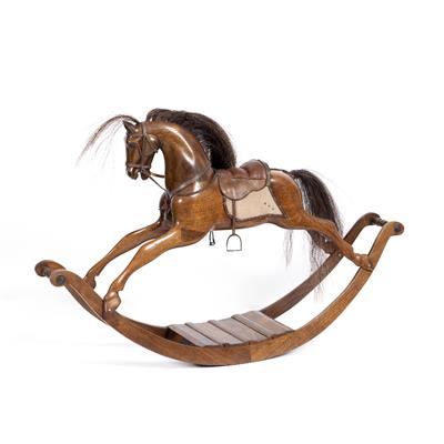 Lot 47 - A MINIATURE CARVED HARDWOOD ROCKING HORSE