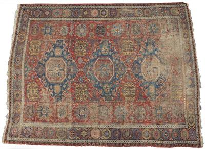 Lot 68 - AN ANTIQUE ORIENTAL RED GROUND RUG