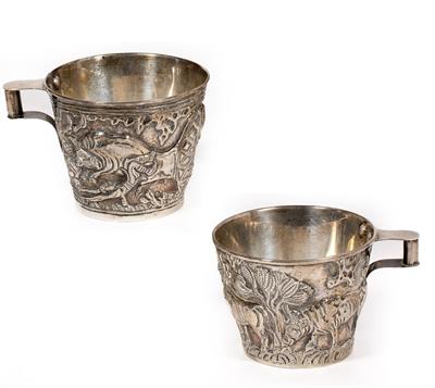 Lot 100 - A PAIR OF WHITE METAL CUPS AFTER THE ANTIQUE