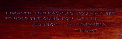 Lot 105 - A 19TH CENTURY CARVED OAK GUN CABINET