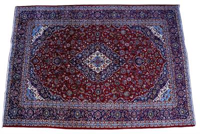 Lot 113 - A KASHAN RED GROUND CARPET