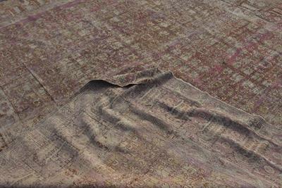 Lot 145 - A TURKISH PINK GROUND GHIORDES CARPET