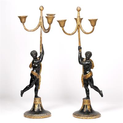 Lot 238 - A PAIR OF 19TH CENTURY PARCEL GILT AND BLACK PAINTED GESSO MOULDED CANDELABRA