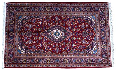 Lot 321 - AN ORIENTAL RED GROUND RUG