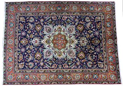 Lot 322 - A DARK BLUE ORIENTAL RUG