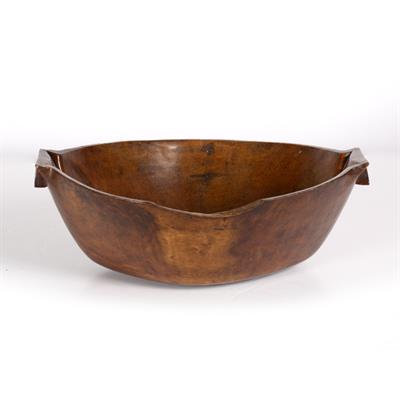 Lot 372 - AN ANTIQUE CARVED HARDWOOD FEASTING BOWL