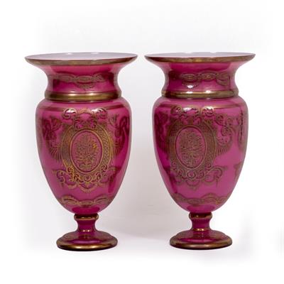 Lot 484 - A PAIR OF GLASS PINK GROUND PARCEL GILT VASES