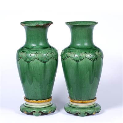 Lot 62 - Pair of green glazed vases and stands