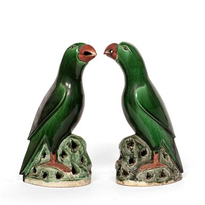 Lot 99 - Pair of porcelain models of green glazed parrots