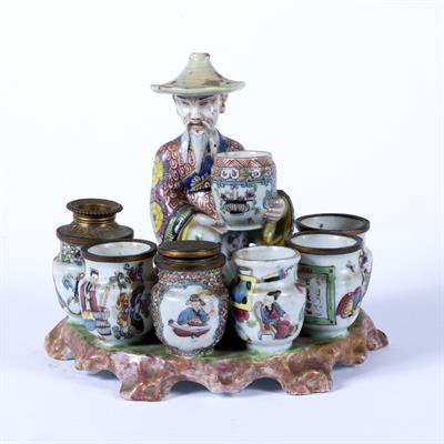 Lot 111 - Porcelain model of a merchant