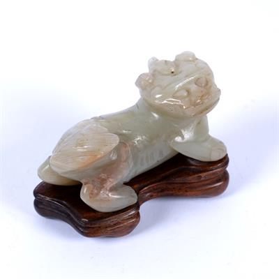 Lot 219 - Mutton fat jade carving of a Buddhistic lion