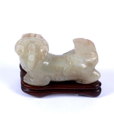 Lot 219 - Mutton fat jade carving of a Buddhistic lion