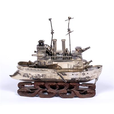 Lot 312 - Small white metal model a steam battleship