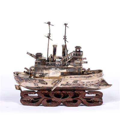 Lot 312 - Small white metal model a steam battleship