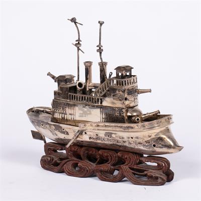 Lot 312 - Small white metal model a steam battleship