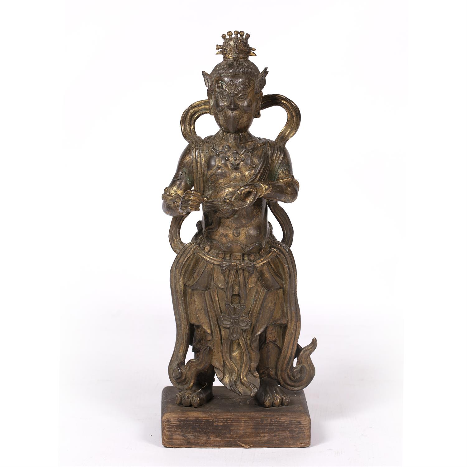 486 - Gilt bronze standing figure of  King Dhanada